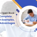 Student solving exam questions at a desk with a calculator and papers, featured in a blog about open book exams